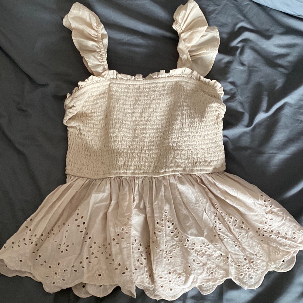 A cream colored shirt to wear in the summer